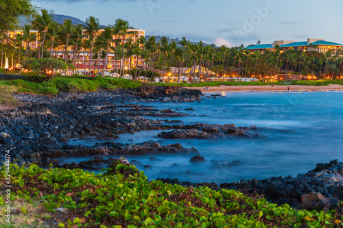 Long exposure picture just after sunset during blue hour of the coast of Wailea Beach on Maui island, Hawaii photo