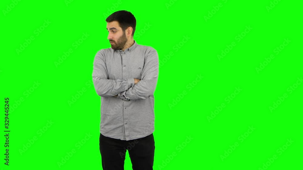 Brunette guy is waiting and angry . Green screen Brunette guy is waiting and angry . Green screen