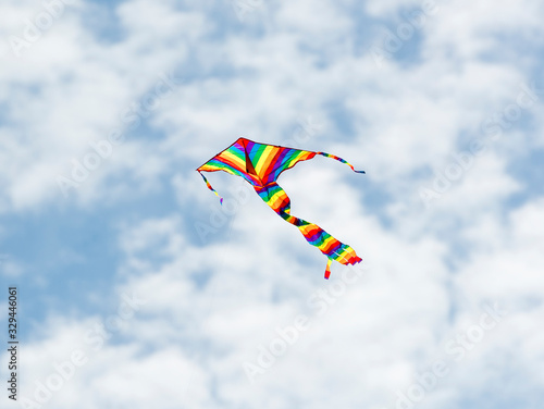 Colorful Kites Flying in blue spring sky 