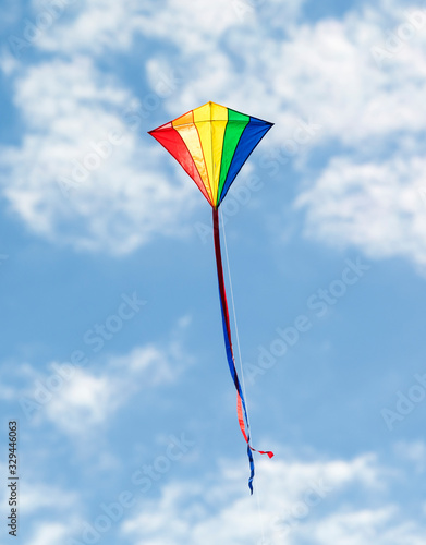 Colorful Kites Flying in blue spring sky 