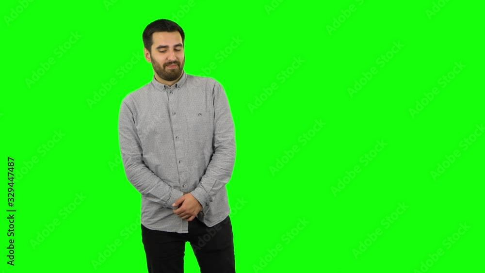 Brunette guy is daydreaming and smiling looking up. Green screen Brunette guy is daydreaming and smiling looking up. Green screen