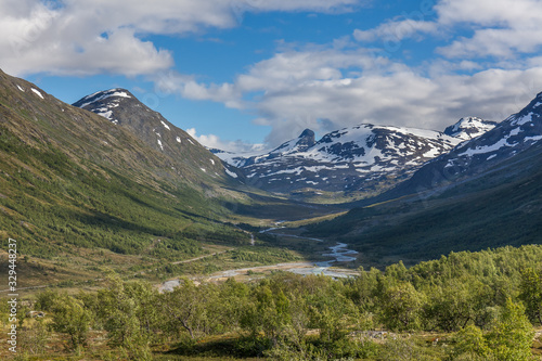 Norwegian summer landscape, wonderful view of snow-capped mountains with clean, cold air in summer, selective focus.