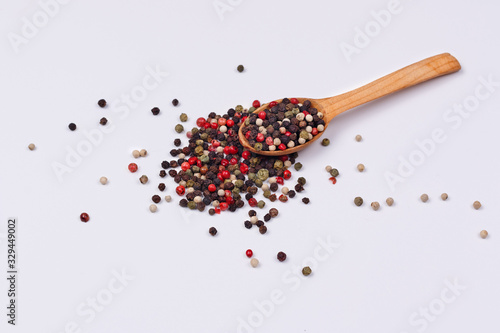 A mixture of red, black, green and white pepper