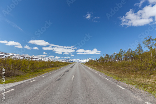 road passing in a valley between mountains in Sweden, selective focus