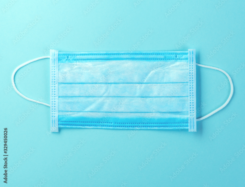 Doctor mask, corona virus protection concept over blue background. Breathing medical respiratory mask. Coronavirus, hospital or pollution protect face masking Doctor mask, corona virus protection concept over blue background. Breathing medical respiratory mask. Coronavirus, hospital or pollution protect face masking
