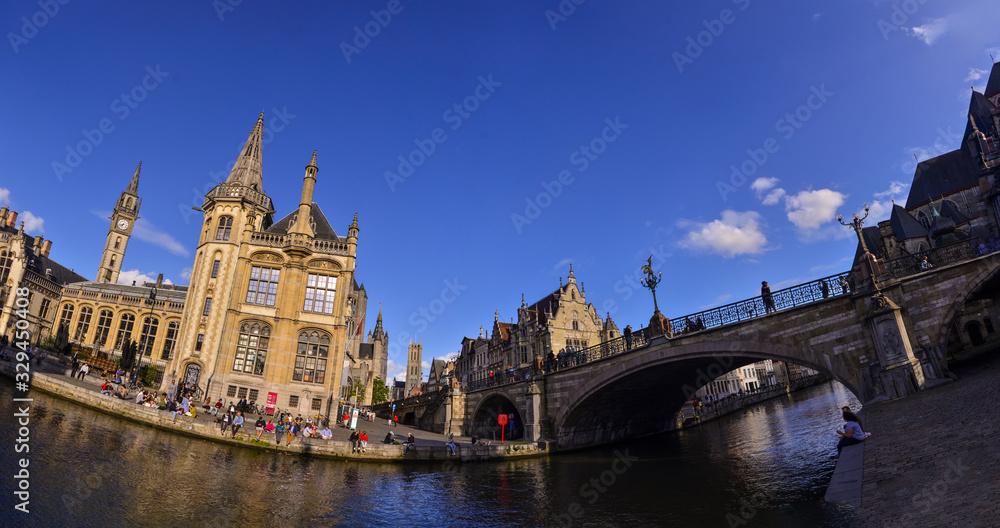 Ghent,Belgium,August 2019. Large format panoramic photo: breathtaking cityscape from the St.Michael bridge along the Graslei canal.One of the most beautiful postcards in the city. People stop to watch