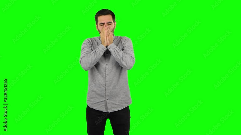 Brunette guy is getting a cold, sore throat and head, cough. Green screen Brunette guy is getting a cold, sore throat and head, cough. Green screen