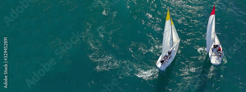 Aerial drone ultra wide photo of sail boats competing in annual regatta race in Saronic gulf, Greece © aerial-drone