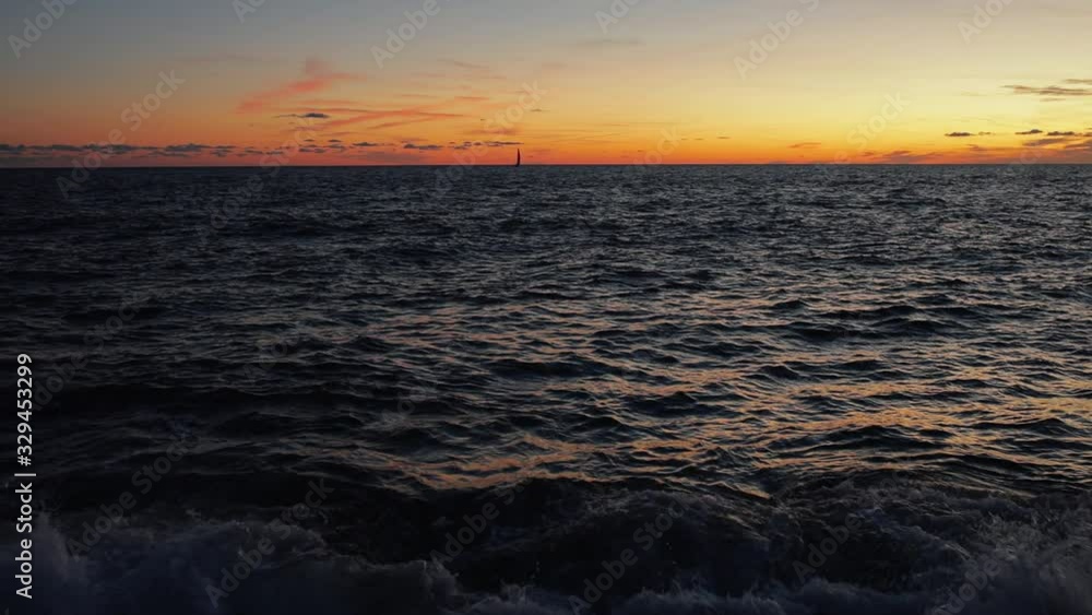 Video of sunset seen from fast moving boat . Aegean sea at sunset. Looking at beautiful sunset sky from moving boat. Push the boat out Video of sunset seen from fast moving boat . Aegean sea at sunset. Looking at beautiful sunset sky from moving boat. Push the boat out