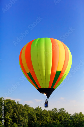 Balloon Festival. Flying balloons against the blue sky. © skelington