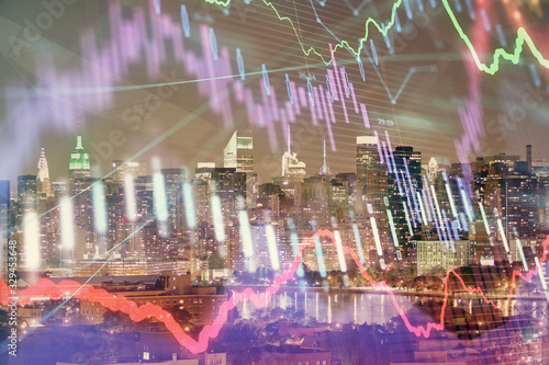 Double exposure of forex chart drawings over cityscape background. Concept of success.