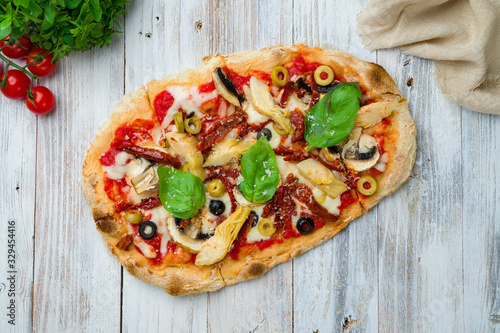 Roman pizza with artichokes and sun-dried tomatoes on Roman dough  pinsa