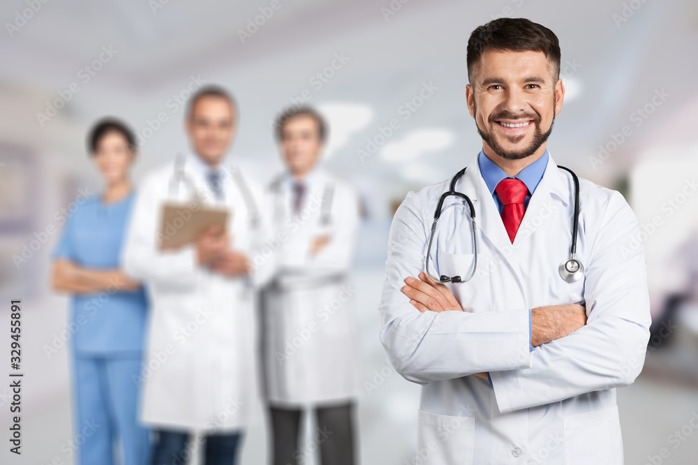 Handsome doctor portrait on hospital background Handsome doctor portrait on hospital background