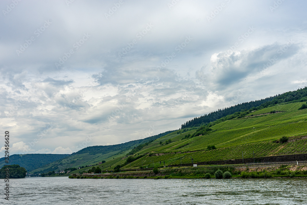 Germany, Rhine Romantic Cruise, a large body of water with a mountain in the background