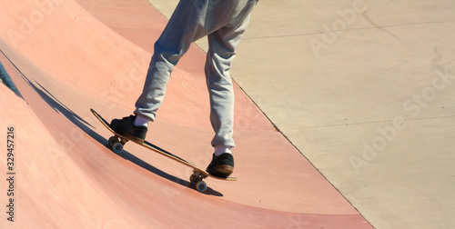 Teenage skateboarder boldly makes extreme jumps on a skateboard  © larisa