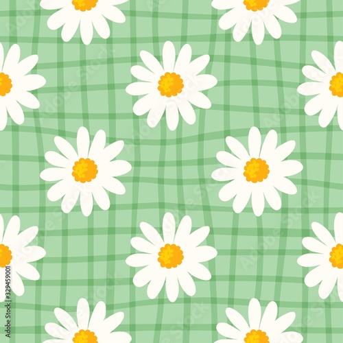 Daisy seamless pattern on hand drawn checked background. Floral ditsy print with small white flowers and leaves. Chamomile trend design great for fashion fabric, kitchen textile and wallpaper.
