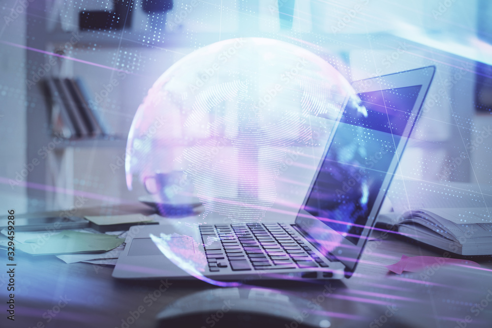 Computer on desktop in office with technology theme hologram. Multi exposure. Tech concept. Computer on desktop in office with technology theme hologram. Multi exposure. Tech concept.