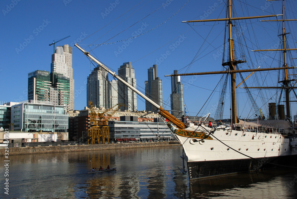 Sailboat and kaiak on Puerto Madero harbor Sailboat and kaiak on Puerto Madero harbor