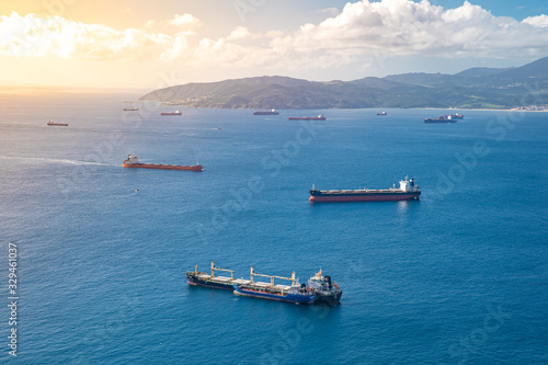 Cargo ships with containers, goods are transported via sea