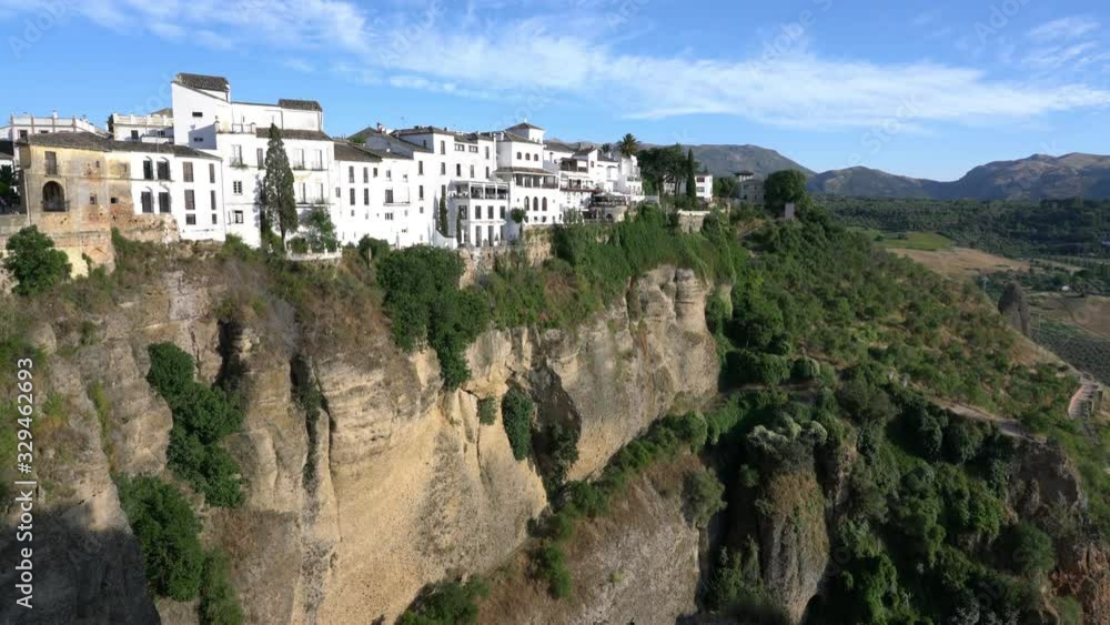 Scenic sight in Ronda with white houses built on high cliffs, Province of Malaga, Andalusia, Spain. Scenic sight in Ronda with white houses built on high cliffs, Province of Malaga, Andalusia, Spain.