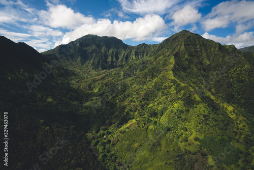 Aerial View of Kauai Landscape in Hawaii with Rugged Mountains and Lush Forests © Ernest