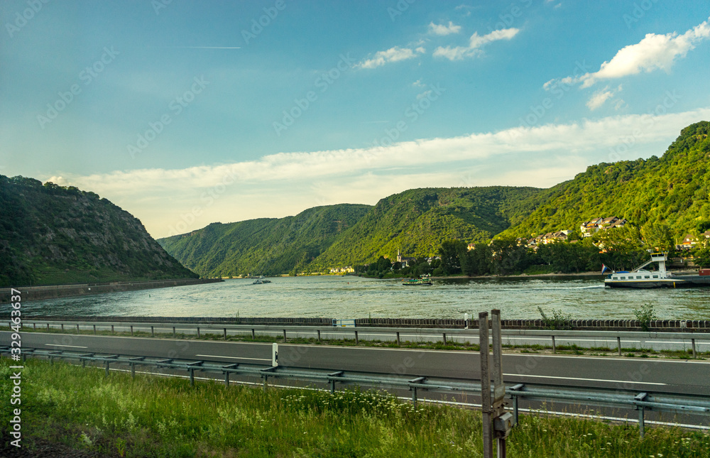 Fototapeta premium Germany, Hiking Frankfurt Outskirts, a wooden bench sitting next to a body of water
