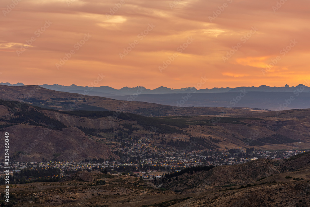 Cityscape view of Esquel against Andes range during colorful sunset in Patagonia, Argentina