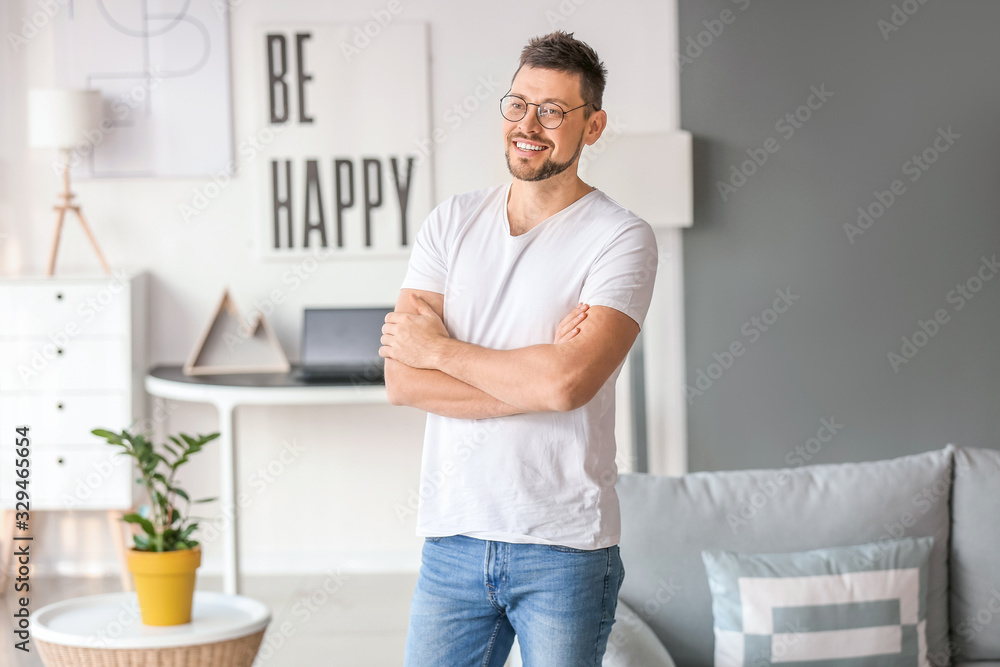 Handsome man wearing glasses at home Handsome man wearing glasses at home