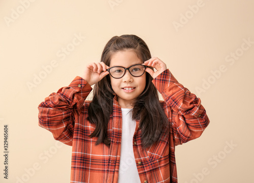 Funny little girl with glas...