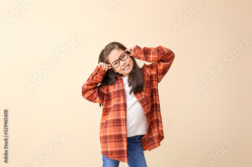 Funny little girl with glas...
