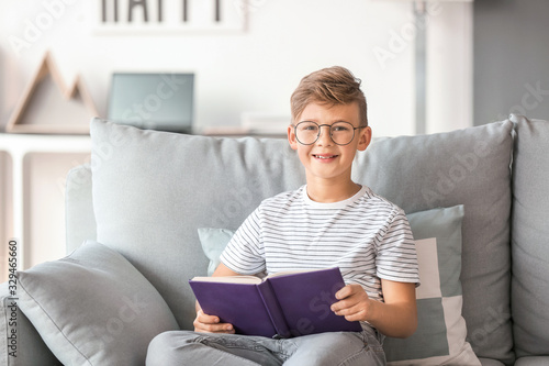 Little boy wearing glasses ...