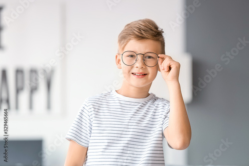 Little boy wearing glasses at home photo