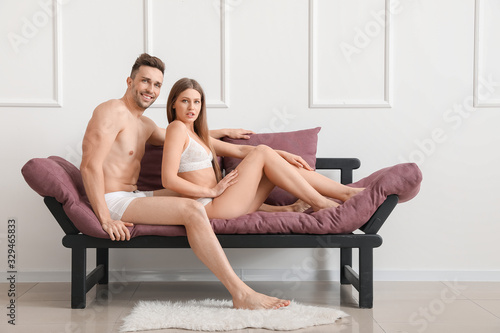 Young couple in underwear o...
