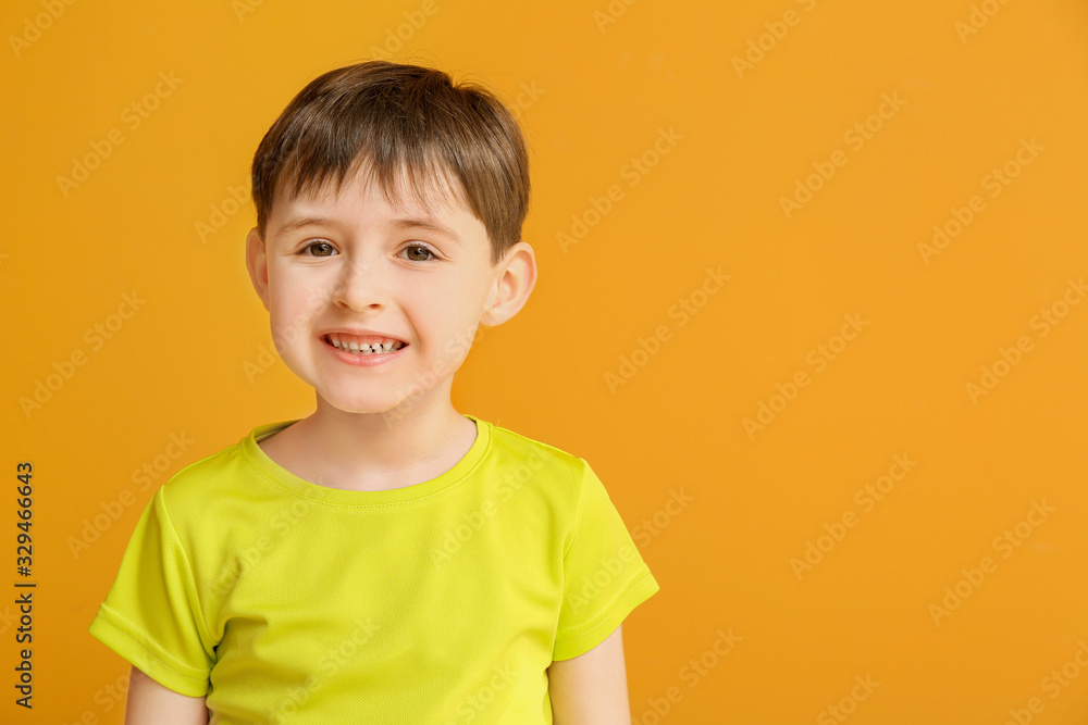 Happy smiling little boy on color background Happy smiling little boy on color background