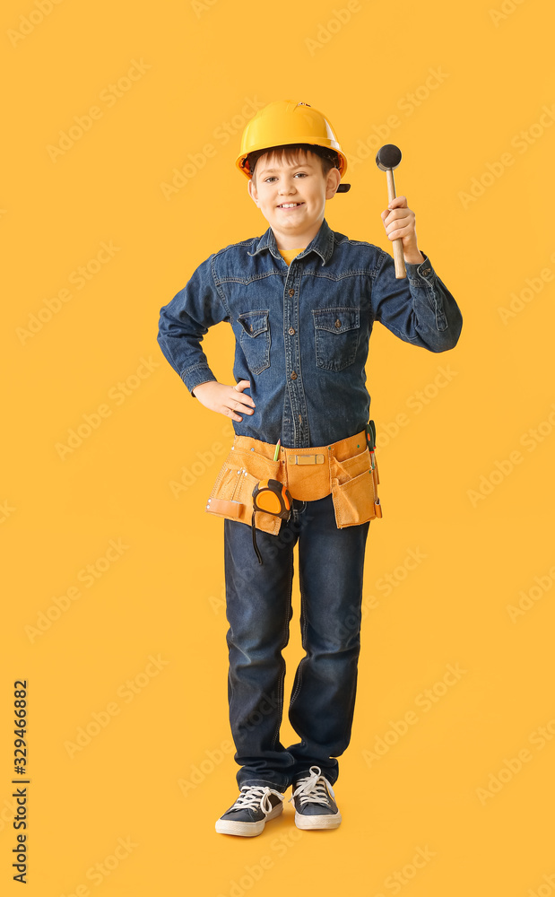 Cute little builder on color background Cute little builder on color background