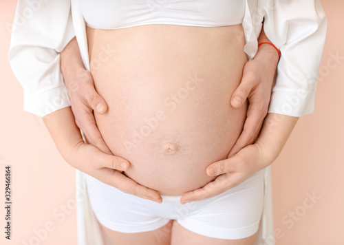 Beautiful pregnant couple o...