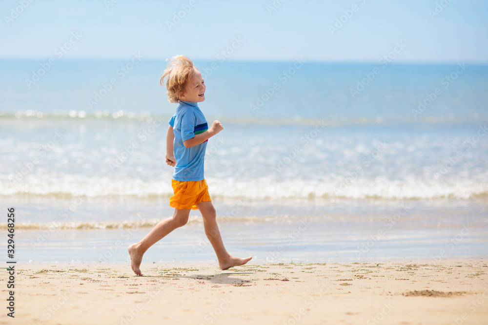 Kids playing on beach. Children play at sea. Kids playing on beach. Children play at sea.