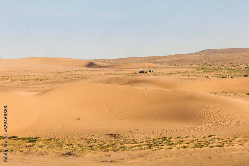 Mongolia Gobi desert, minibus and tourist tent in Khongor sand dunes Mongolia Gobi desert, minibus and tourist tent in Khongor sand dunes