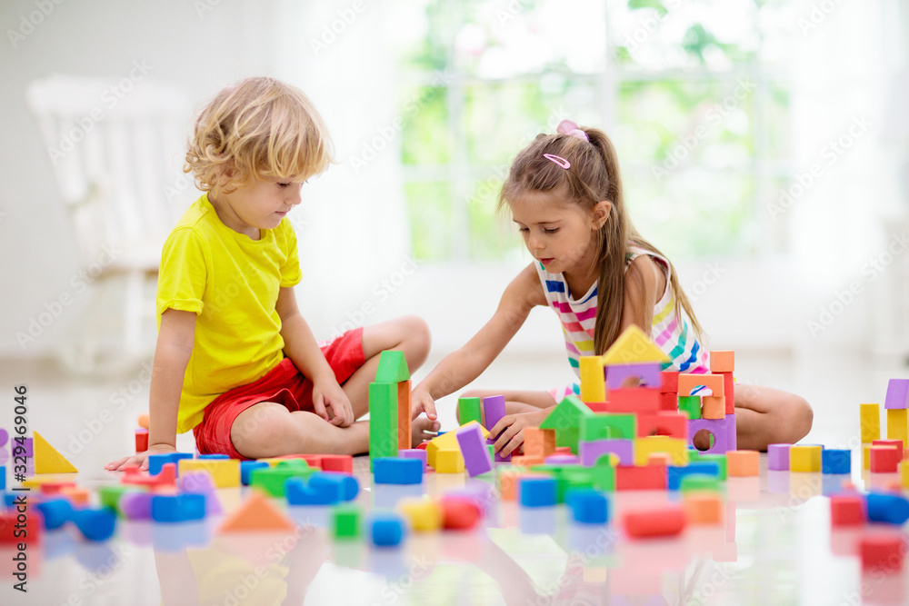 Fototapeta premium Child playing with toy blocks. Toys for kids.