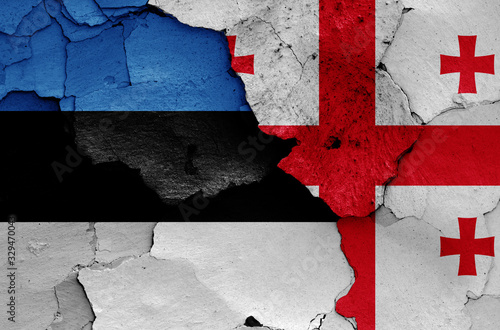 flags of Estonia and Georgia painted on cracked wall