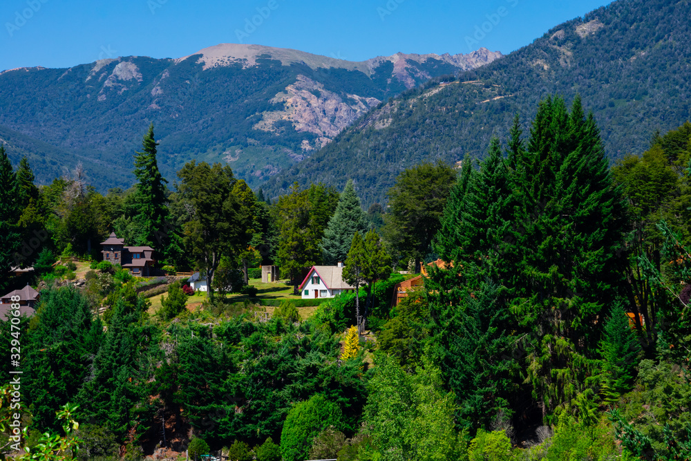 Houses in the forest near Perito Moreno Lake. Taken from Llao Llao Hotel. Bariloche, Argentina