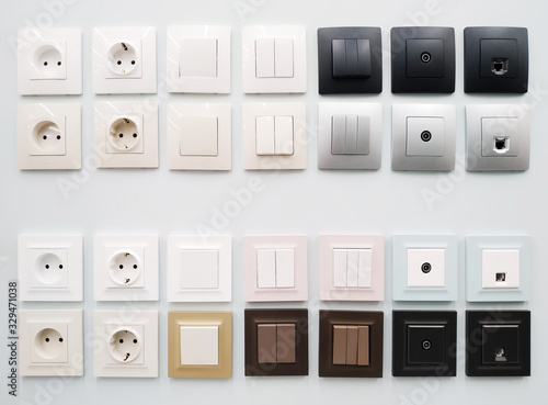 Various electrical switches and sockets on the stand in the household store