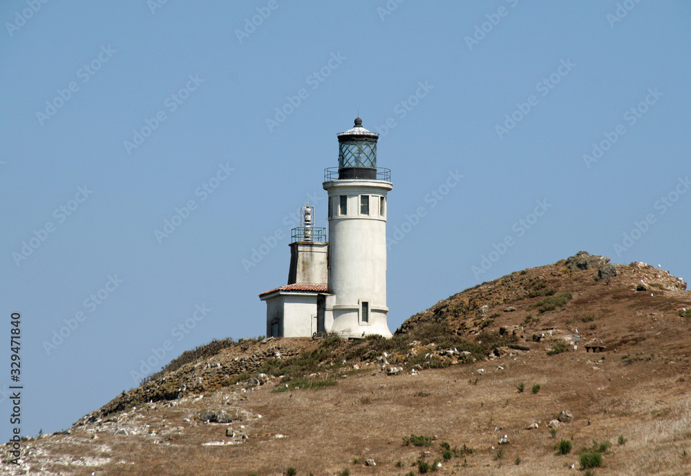 Lighthouse on East Anacapa Island in Channel Islands National Park, California on sunny summer afternoon.