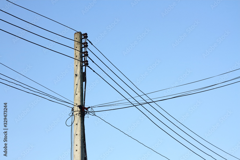 Electric pole or utility pole supporting wires for various public utilities such as cable internet and telephone with fresh blue sky Electric pole or utility pole supporting wires for various public utilities such as cable internet and telephone with fresh blue sky