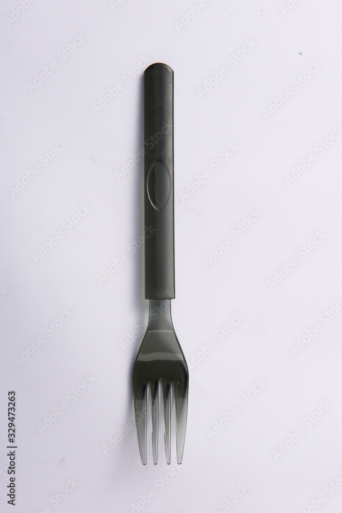 A disposable fork spoon. Quick and comfortable to use at parties. Recycle tableware. Plastic processing problems A disposable fork spoon. Quick and comfortable to use at parties. Recycle tableware. Plastic processing problems