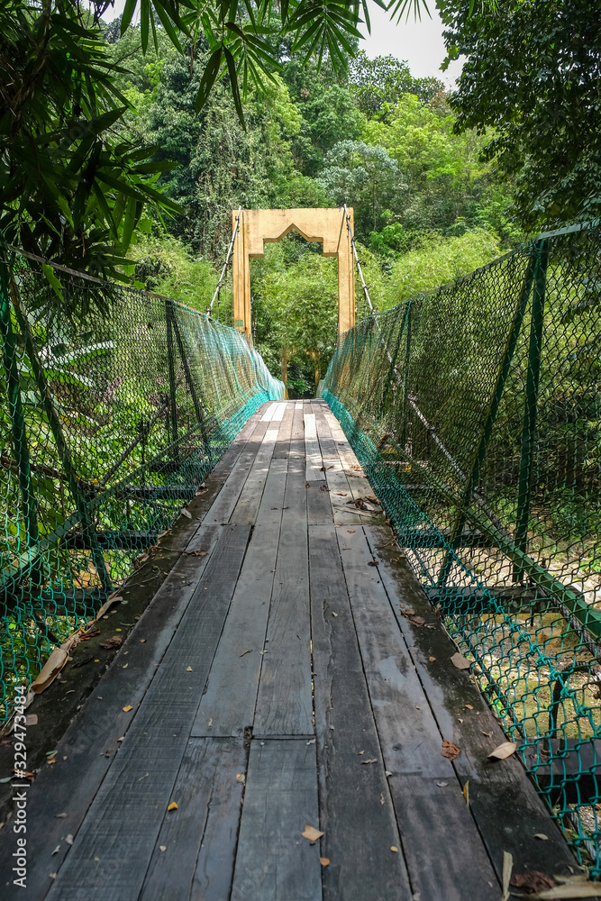The hanging wooden bridge at the top of lata kinjang waterfall Chenderiang Tapah Perak. Photo taken on the 8th March 2020.