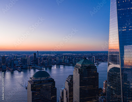 Photography Aerial view of New York city and one world trade center brookfield place at dusk