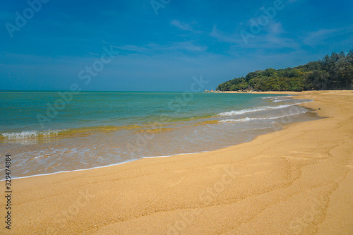 Golden sand beach has sand, sea water, sand, the sea water on the sand.