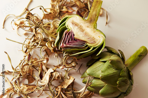 Fresh artichoke and dried leaves photo