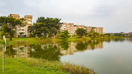 Tangerang, Indonesia - 7th June 2019: Rainbow Springs Condo Villa, a luxury apartment complex, next to a lake, in Gading Serpong residential area. It is an area with high property development. © HaniSantosa